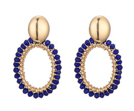 Oorbellen goud en blauw